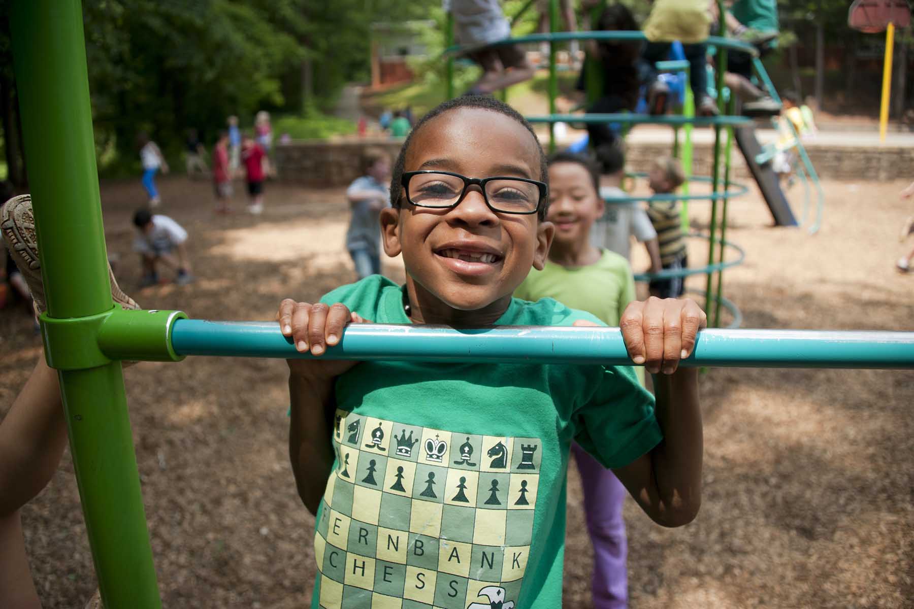 Boy Playing on Playground
